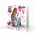 Personalised 13th Birthday Card - Girl Using a Phone with Pink Hearts and Balloons