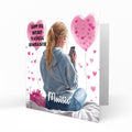 Personalised 13th Birthday Card - Girl Using a Phone with Pink Hearts and Balloons